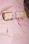 Conjunto con detalles en broches dorados