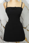 Vestido corto con detalle en moños