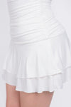 Vestido strapless corto con olanes