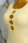 Vestido corto tableado con moños