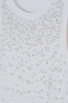 Blusa con detalle de piedras y perlas