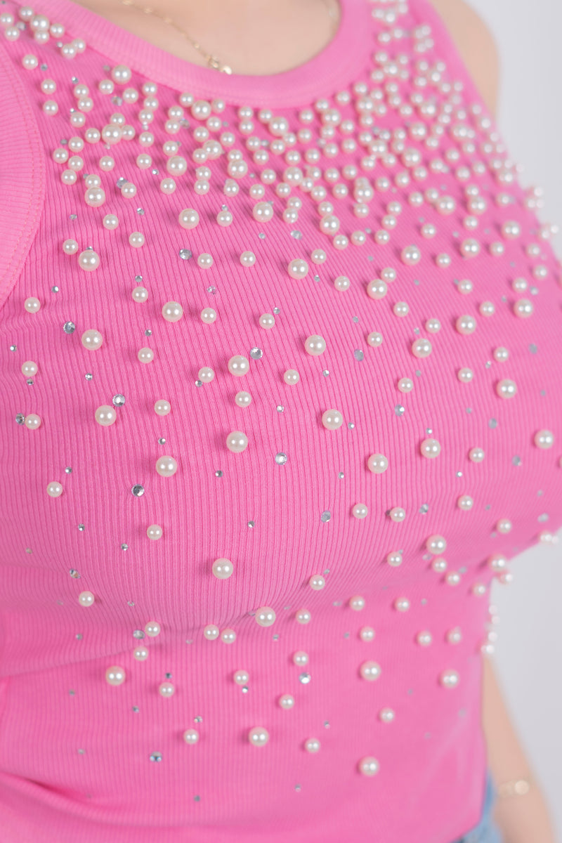 Blusa con detalle de piedras y perlas