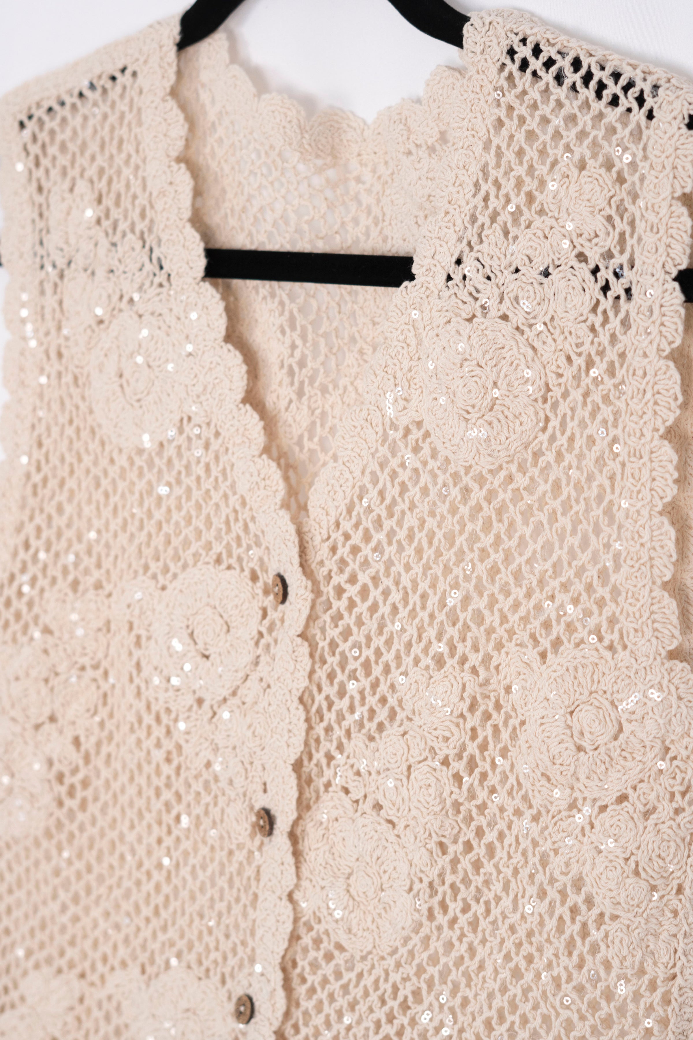 Blusa tejida con detalles en lentejuelas