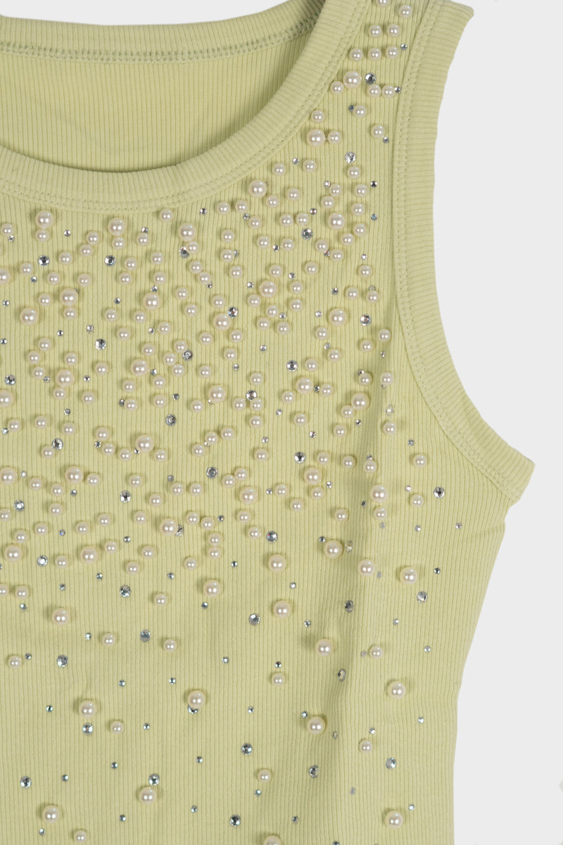 Blusa con detalle de piedras y perlas