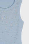 Blusa con detalle de piedras y perlas