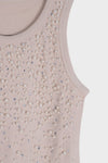 Blusa con detalle de piedras y perlas
