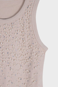 Blusa con detalle de piedras y perlas