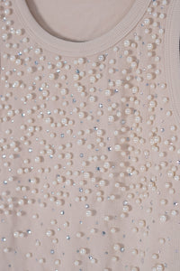Blusa con detalle de piedras y perlas